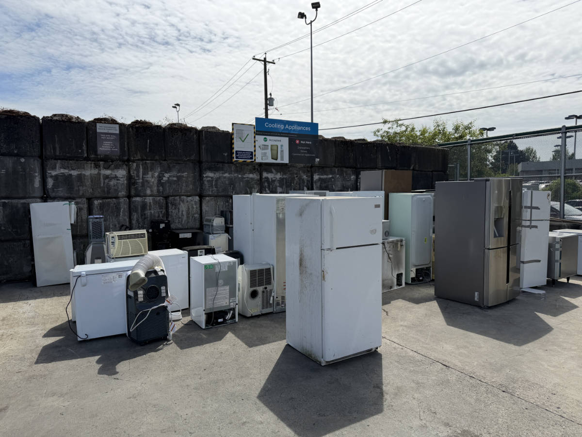 Refrigerators, freezers, and cooling appliances collected at a Metro Vancouver recycling facility for responsible disposal.
