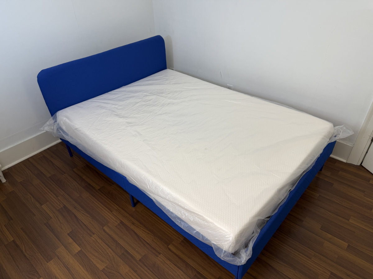 Mattress and upholstered bed frame delivered and assembled in a client's home by Eco Van Move.